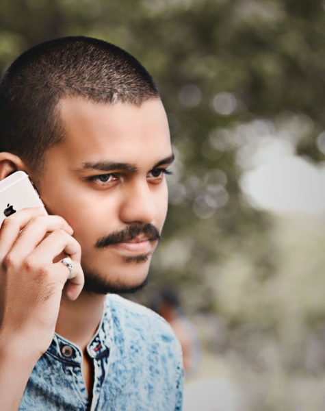 selective-focus-photography-of-man-holding-gold-iphone-6-1484184